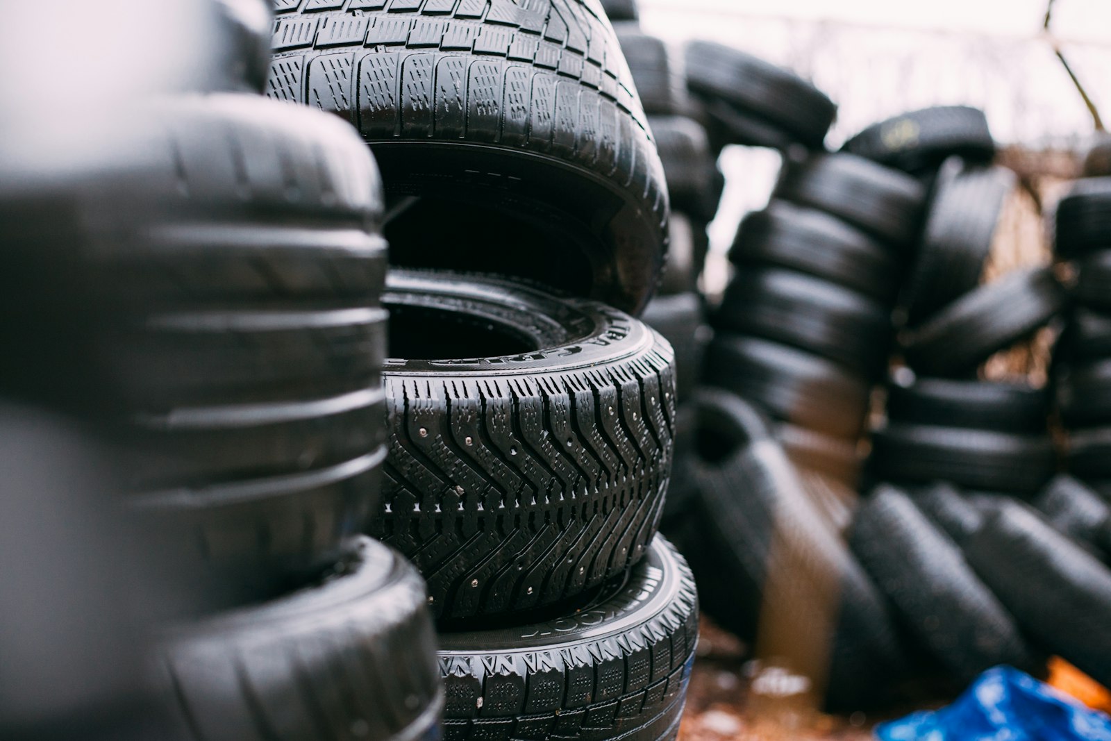 Stacked end-of-life tires ready for recycling